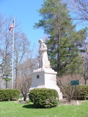 Marker is to the Left of the Madonna of the Trail Statue. Click for full size. Marker is to the Left of the Madonna of the Trail Statue image. Click for full size.