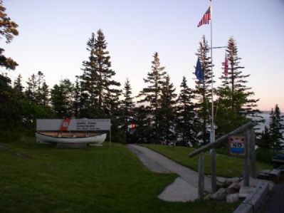 Flagpole and Rescue Boat at Bass Harbor Head Light. Click for full size. Flagpole and Rescue Boat at Bass Harbor Head Light image. Click for full size.