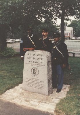 visiting Civil War re-enactors pose at memorial image, Touch for more information