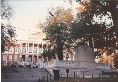 The memorial's reverse with the Massachusetts State House in the background image. Click for full size.