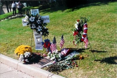 Curbside remembrances to John F. Kennedy.. Click for full size. Curbside remembrances to John F. Kennedy. image. Click for full size.
