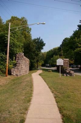 Remains of trolley trestle with Ellicott's Mills Marker. image. Click for full size.