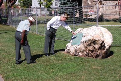 Two Veterans examine the marker in Summer 2007 prior to a local parade image. Click for full size.