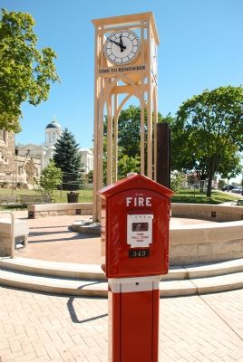 Traditional fire alarm box incorporated into memorial image. Click for full size.