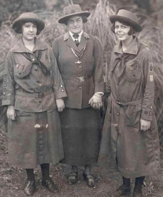 Juliette Gordon Low (center) standing with two Girl Scouts, image. Click for full size.