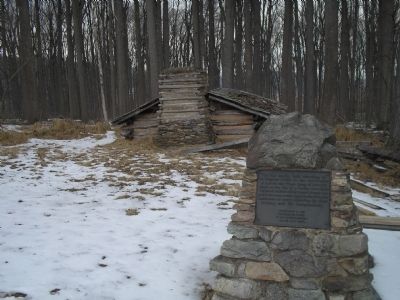 Marker with Hut in background. Click for full size. Marker with Hut in background image. Click for full size.