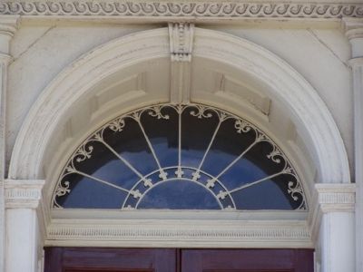 Window above the front entrance. image. Click for full size.