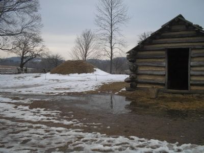 Log Cabin with a bee hive oven in background image. Click for full size.
