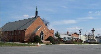 The crucifix and the church as viewed from Old Branch Ave.. Click for full size. The crucifix and the church as viewed from Old Branch Ave. image. Click for full size.