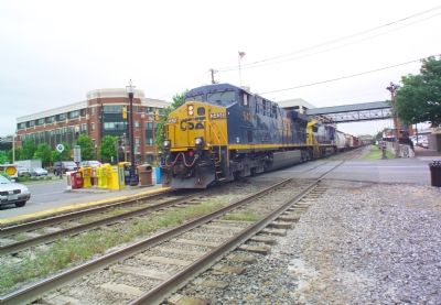 Eastbound Freight Passes the Station image. Click for full size.