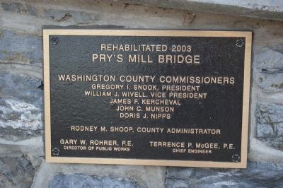 Plaque on the bridge, describing its restoration image. Click for full size.