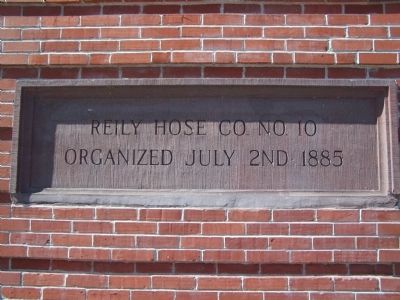 Plaque on wall of fire house image. Click for full size.