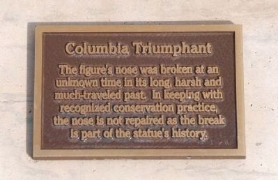Plaque at base of statue explaining why Columbia doesn't get her nose fixed! image. Click for full size.