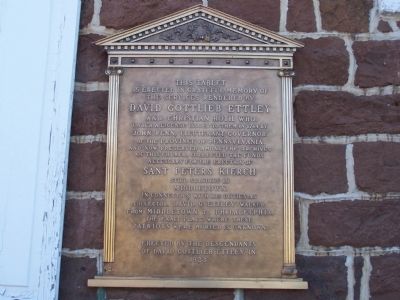 Plaque on wall of church image. Click for full size.