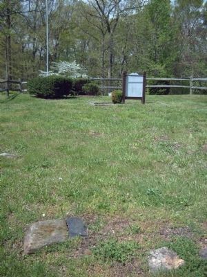 Behind the marker, possible foundation stones? image. Click for full size.