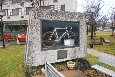 Furman Kugler's Bicycle is on display in this outdoor case image. Click for full size.