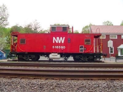 NW Caboose 518590 and Marker at the Caboose Plaza image. Click for full size.