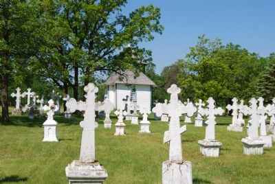 Gravestones in cemetery and church image. Click for full size.