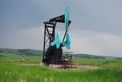 An active oil well in the Turner Valley field image. Click for full size.