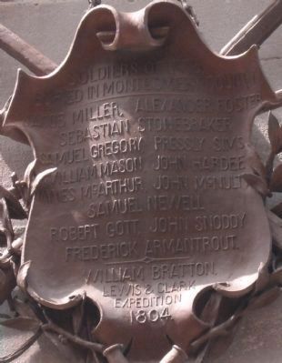 Brass Shield on the back of the monument image. Click for full size.
