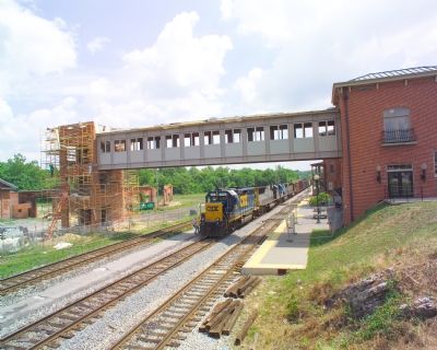 Pedestrian Bridge Connects Station to Shops image. Click for full size.