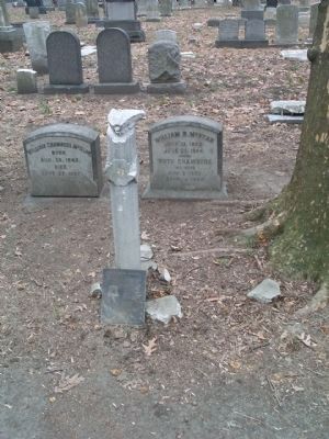 William R. McKean Marker leaning against marker post. image. Click for full size.