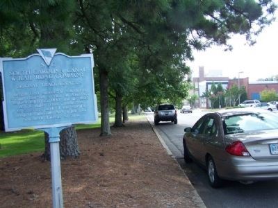 South Carolina Canal & Rail Road Company Marker, looking west along Park Ave. (Old Railroad cut) image. Click for full size.