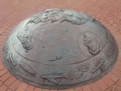Center bronze dome depicting the continents of earth image. Click for full size.
