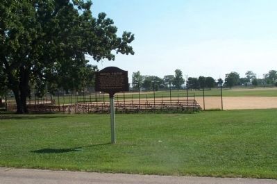 Potter's Field Marker with baseball fields in the background. image. Click for full size.