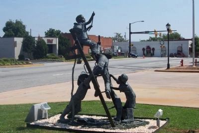 "The Fire Boys Team" sculpture. Click for full size. "The Fire Boys Team" sculpture image. Click for full size.