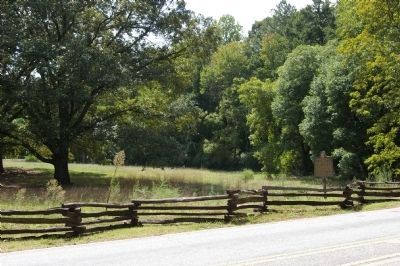 Peachtree Trail Marker (at right) in a field at the Kennesaw Mountain National Battlefield image. Click for full size.