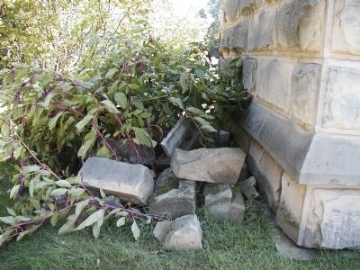 Pieces of broken tombstones behind crypt. Click for full size. Pieces of broken tombstones behind crypt image. Click for full size.