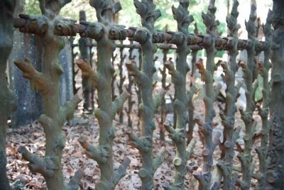 Detail of Iron Fence Work Surrounding a Grave. Click for full size. Detail of Iron Fence Work Surrounding a Grave image. Click for full size.