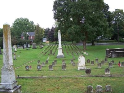 Obelisk and 114 Confederate grave stones. image. Click for full size.