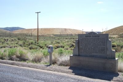 Marker and waste rock piles in the distance. Click for full size. Marker and waste rock piles in the distance image. Click for full size.