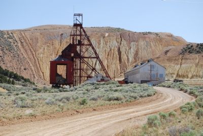 Old mine headframe and ore processing plant image. Click for full size.