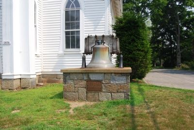 The bell in front of the meeting house image. Click for full size.