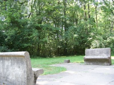 Stone benches next to the inscribed stone image. Click for full size.