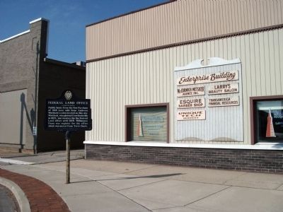 "Enterprise Building" Behind Federal Land Office Marker. Click for full size. "Enterprise Building" Behind Federal Land Office Marker image. Click for full size.