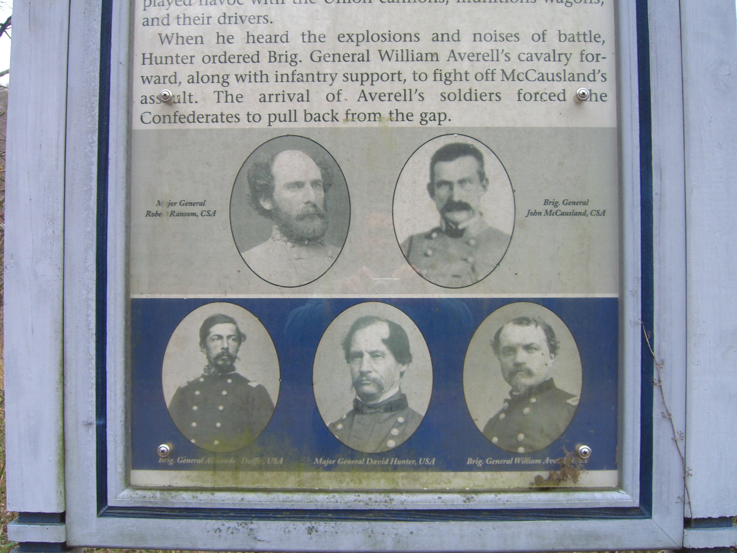 Closeup of portraits on the McCausland Attacks Marker