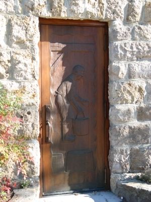 Carved Wooden Door at Side Entrance to Winery Building image. Click for full size.