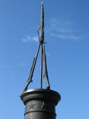 Stand of Rifles and Flag atop the Monument image. Click for full size.