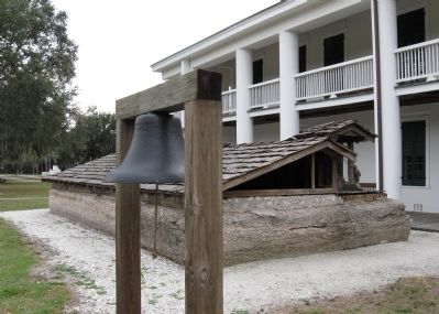 Gamble Mansion bell and cistern at the rear of the house image. Click for full size.
