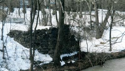 Remains of the Civil War era bridge abutment in the yard of the Palmer House image. Click for full size.