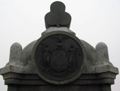 State Seal and Trefoil on Top of Monument. Click for full size. State Seal and Trefoil on Top of Monument image. Click for full size.