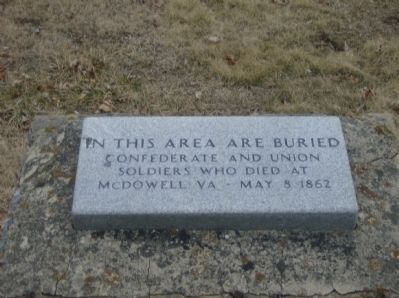 Soldiers' burial marker in church cemetery image. Click for full size.