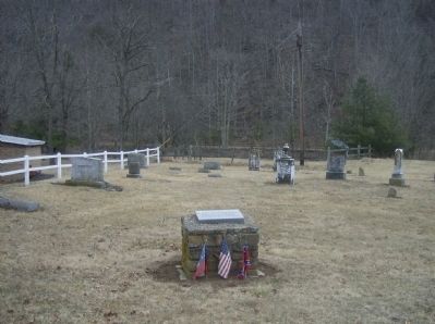 Soldiers' burial marker in church cemetery image. Click for full size.