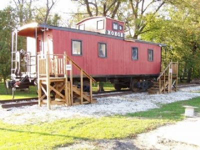 Monon Caboose in the park (site of Monon Station). image. Click for full size.