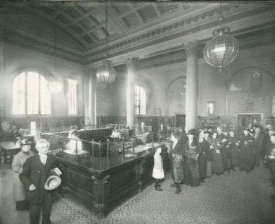 Patrons at the Check-out Desk of the Oakland Free Library, 1904 image. Click for full size.