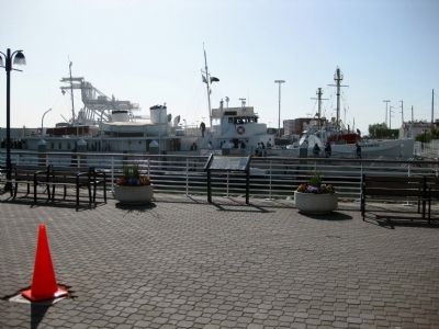 USS Potomac Marker, With USS Potomac in the Background. Click for full size. USS Potomac Marker, With USS Potomac in the Background image. Click for full size.